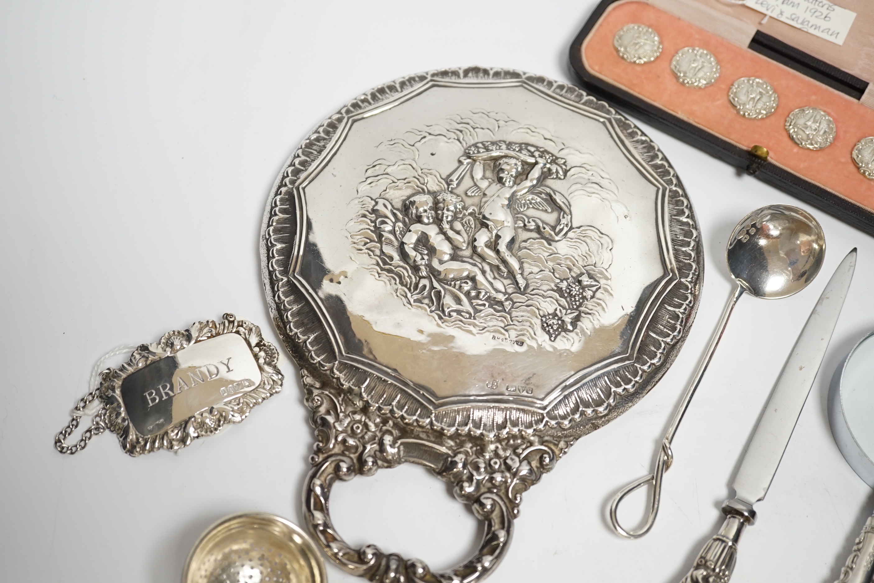 Sundry small silver including a cased set of six late Victorian silver buttons, Birmingham, 1900, a George V silver rattle bell, a silver hand mirror, wine label, scent bottle, etc.